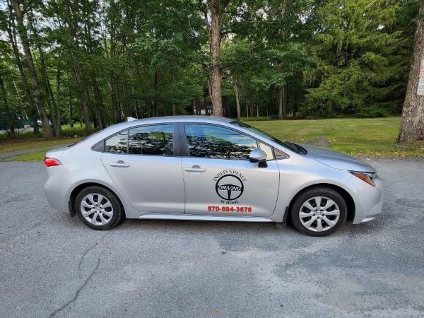 Student driver in the car with an instructor